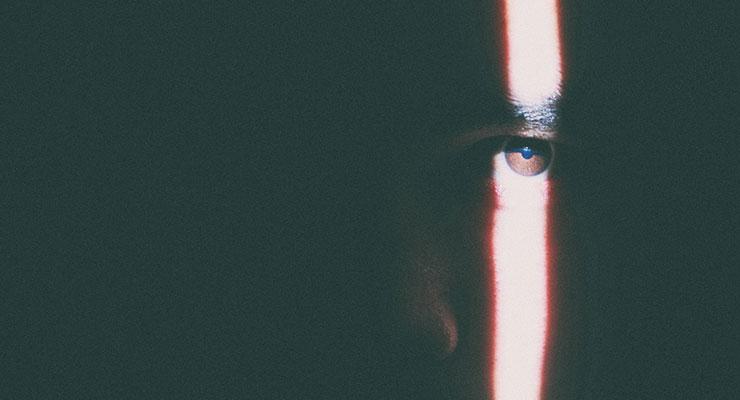 Are You Willing to Give up Your Utopian Constructs? by Gary Douglas. Photograph of a man's eyes with a band of light shining down it by Larm Rmah