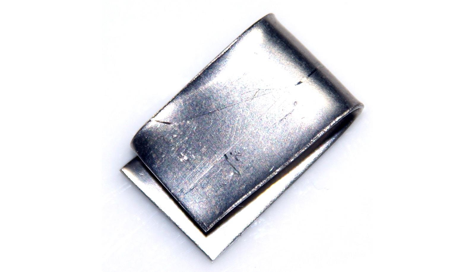 folded sheet of nickel (silver metal) on white