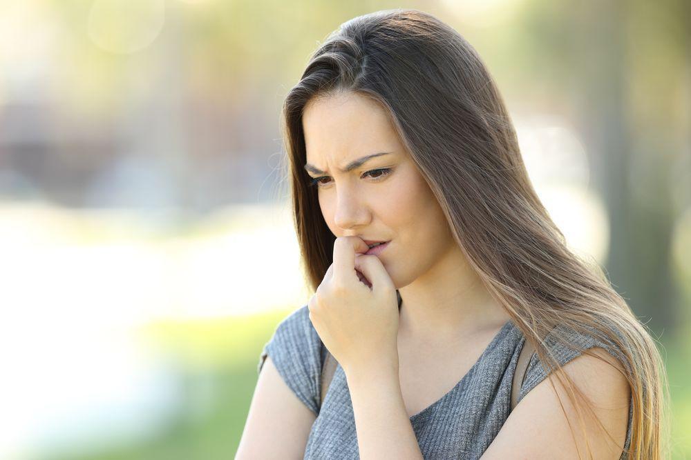 Woman Biting Her Nails