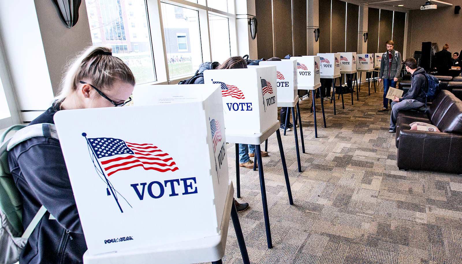 voting booths in line