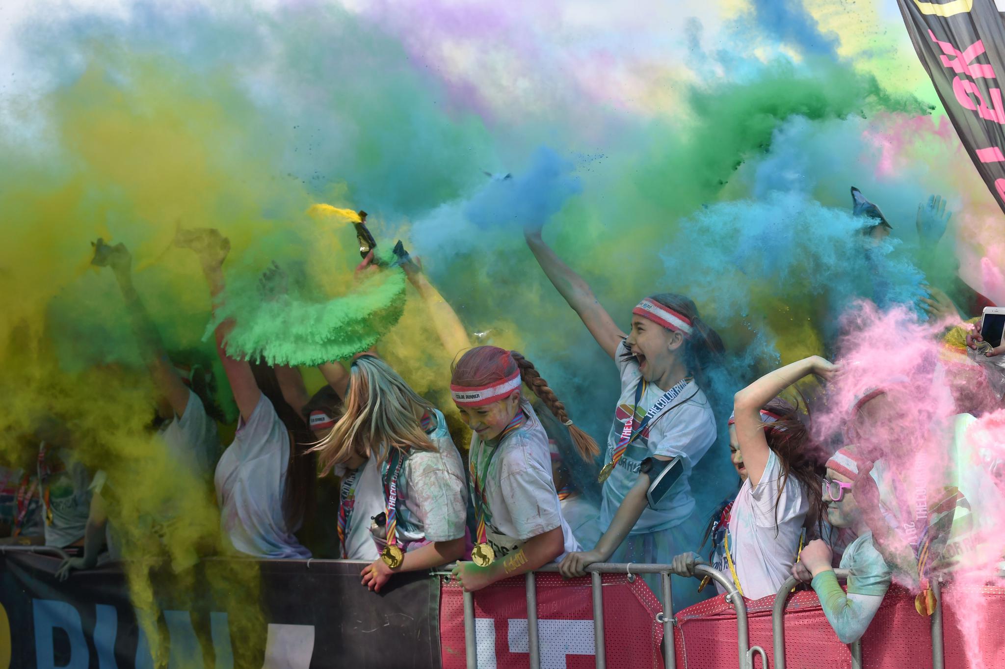 Runners participate in the annual Color Run in Centennial Park in Sydney on August 20, 2017. People with synesthesia "see" colors attached to letters and numbers.