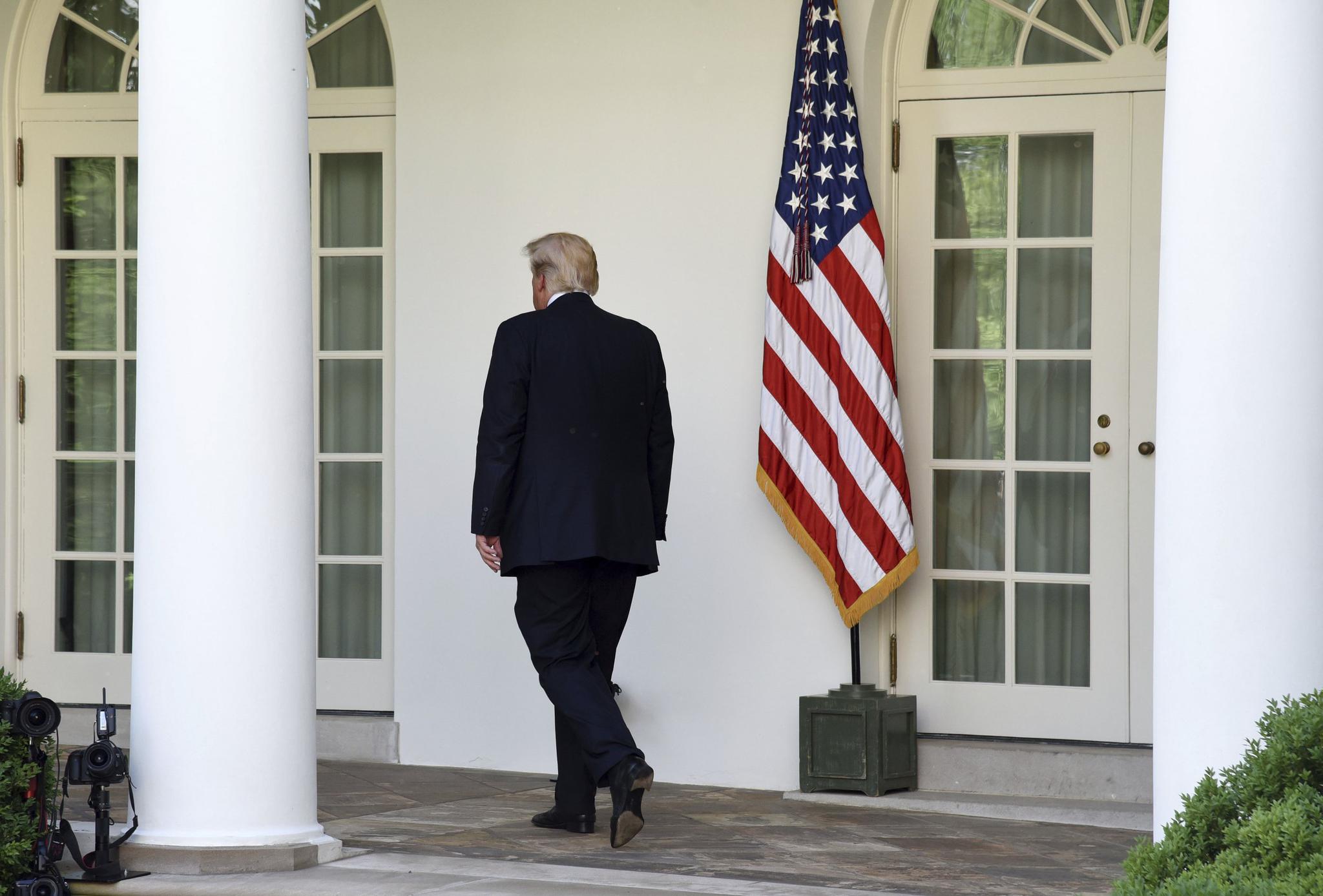 President Donald Trump walks back to the Oval Office after making a statement on The Paris Climate Change Accord in the Rose Garden of the White House, on June 1, 2017 in Washington, DC.