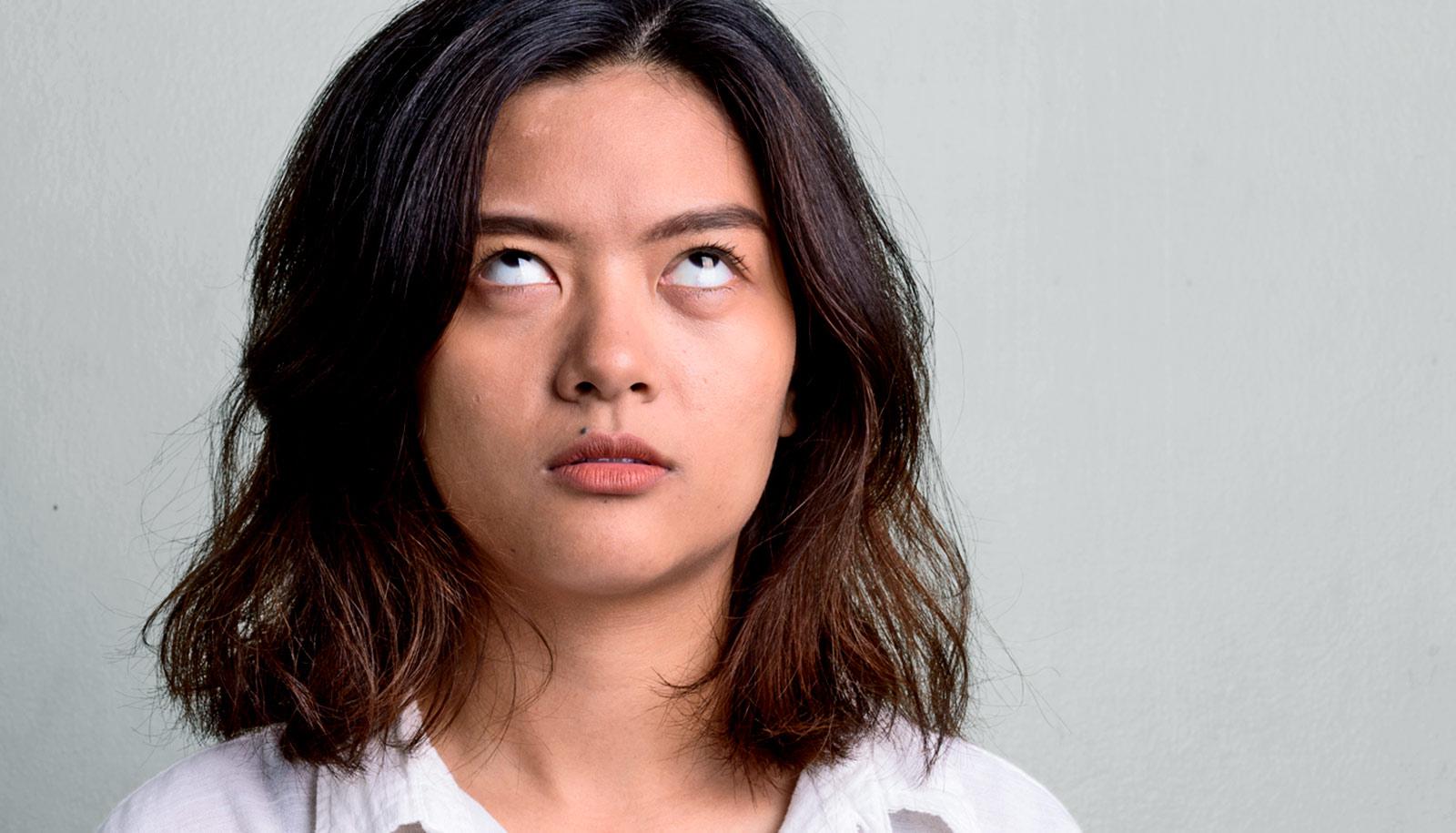 woman rolls her eyes