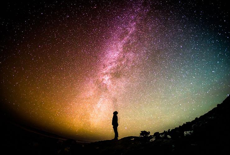 Saying YES to Life by Barbara Ann Briggs. Photograph of a man looking up at the stars by Greg Rakozy