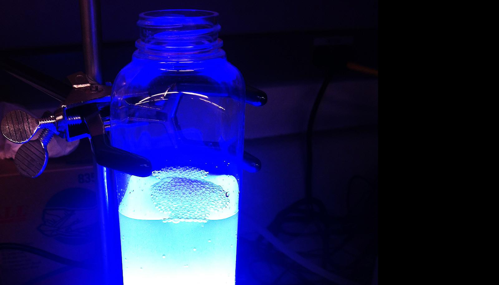 substance in lab container under bright light