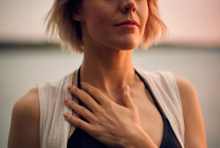 Beyond Competition: What is Actually Possible for Women by Tanja Barth. Photograph of woman with hand over heart by Darius Bashar