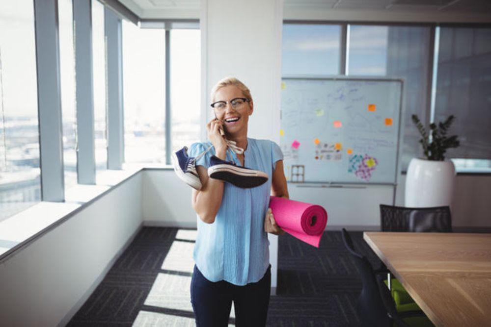 Woman with yoga mat