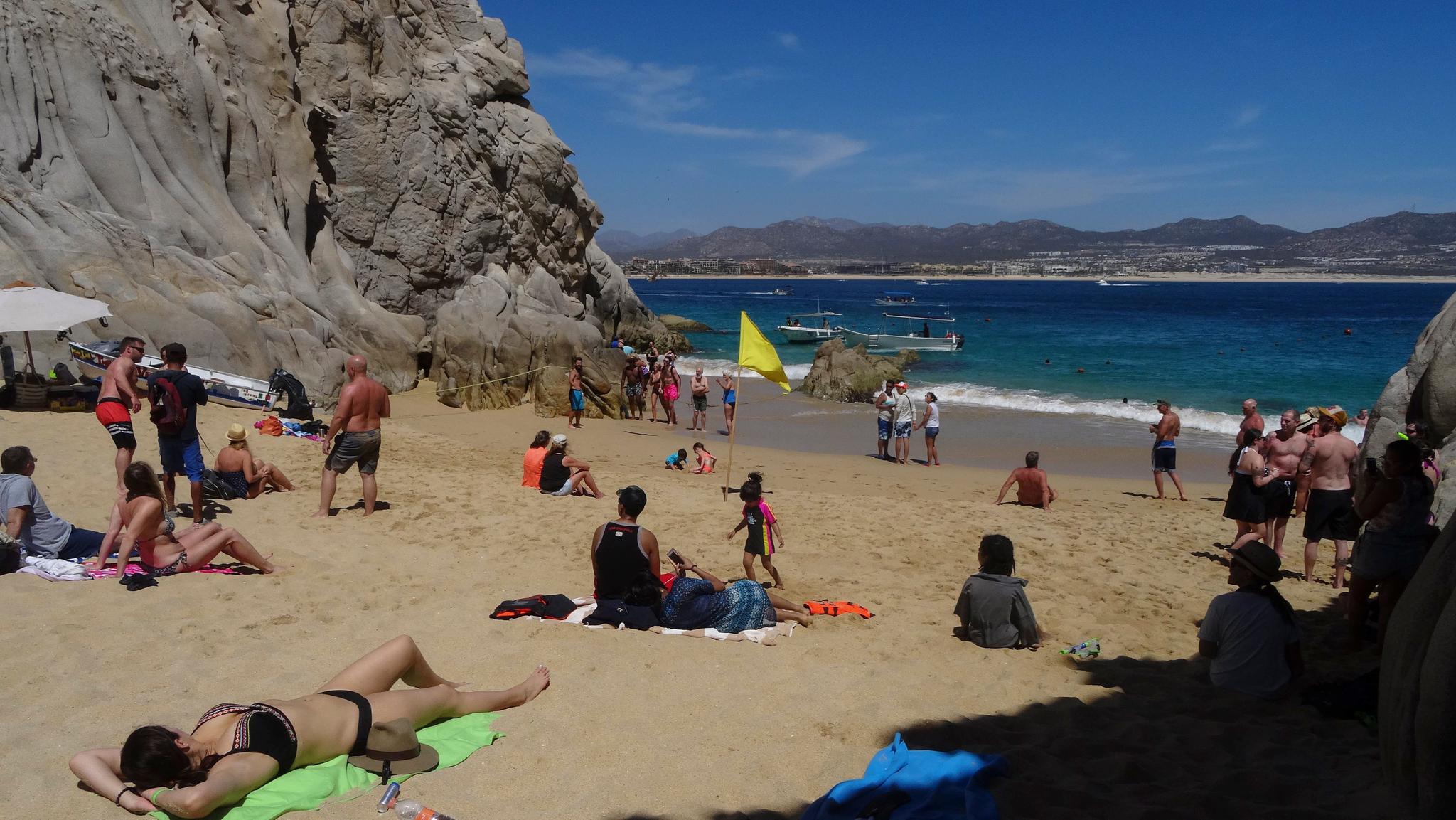 People on vacation in Mexico's Baja California Sur state visit Los Cabos and enjoy the sun at the "Love Beach." Sunscreen chemicals long available in Europe have not yet reached American sunbathers.