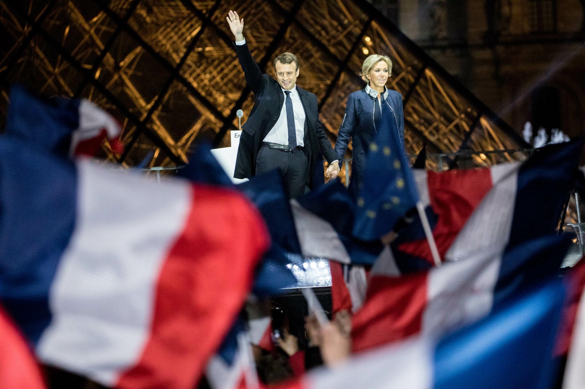 French president-elect Emmanuel Macron waves to the crowd at the Pyramid at the Louvre Museum in Paris on May 7. Emmanuel Macron was elected French president in a resounding victory over far-right National Front rival Marine Le Pen after a deeply divisive campaign.