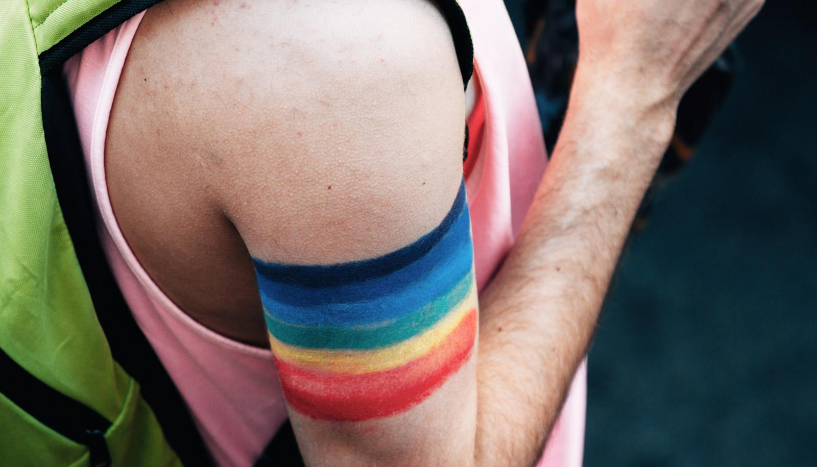 pride flag painted on arm