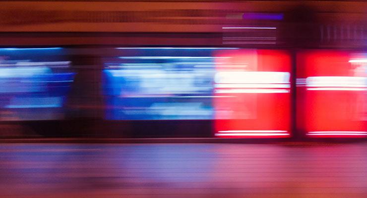 Choose Love: A Vital Strategy for More Success by Kate Beeders. Photograph of red and blue moving lights by Alem Omerovic