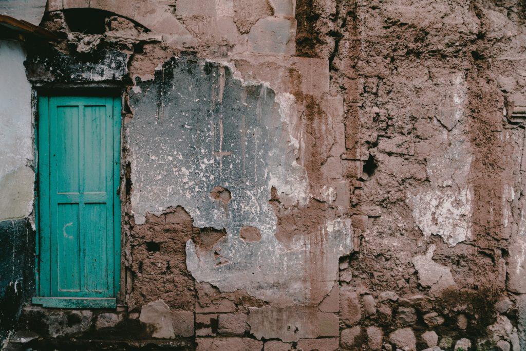 Life as a Refugee: The Struggle to Create a Better Life, by Noor Ghazi. Photograph of war torn wall by Rod Long.