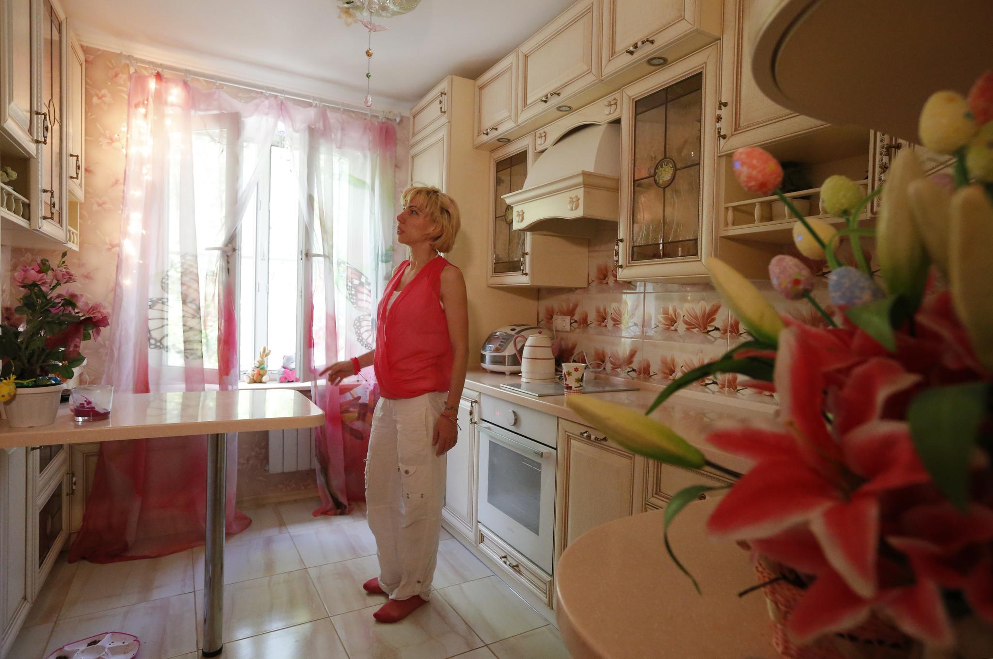 Anti-demolition activist Kari Guggenberger shows the kitchen of her apartment in a building to be demolished under the city authorities' renovation plan, in Moscow, Russia, on May 7, 2017.