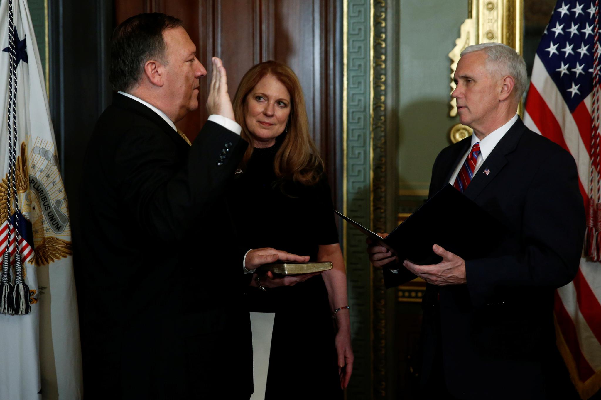 Vice President Mike Pence (right) swears in Mike Pompeo&mdash;flanked by Pompeo's wife, Susan&mdash;to be director of the CIA in Washington, D.C., on January 23.