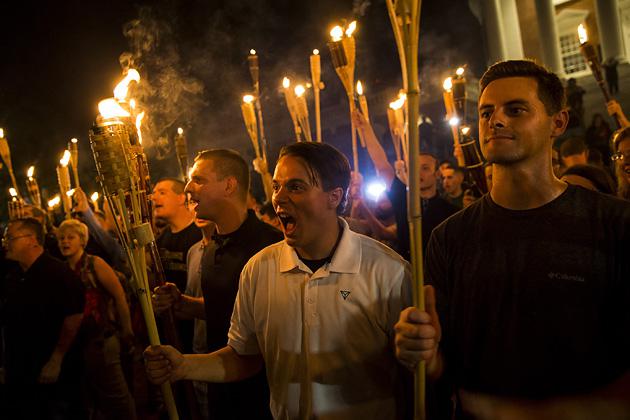 White supremacists encircle and chant at counter-protesters after marching through the University of Virginia campus with torches in Charlottesville, Virginia, on Aug. 11. (Samuel Corum/Anadolu Agency/Getty Images)