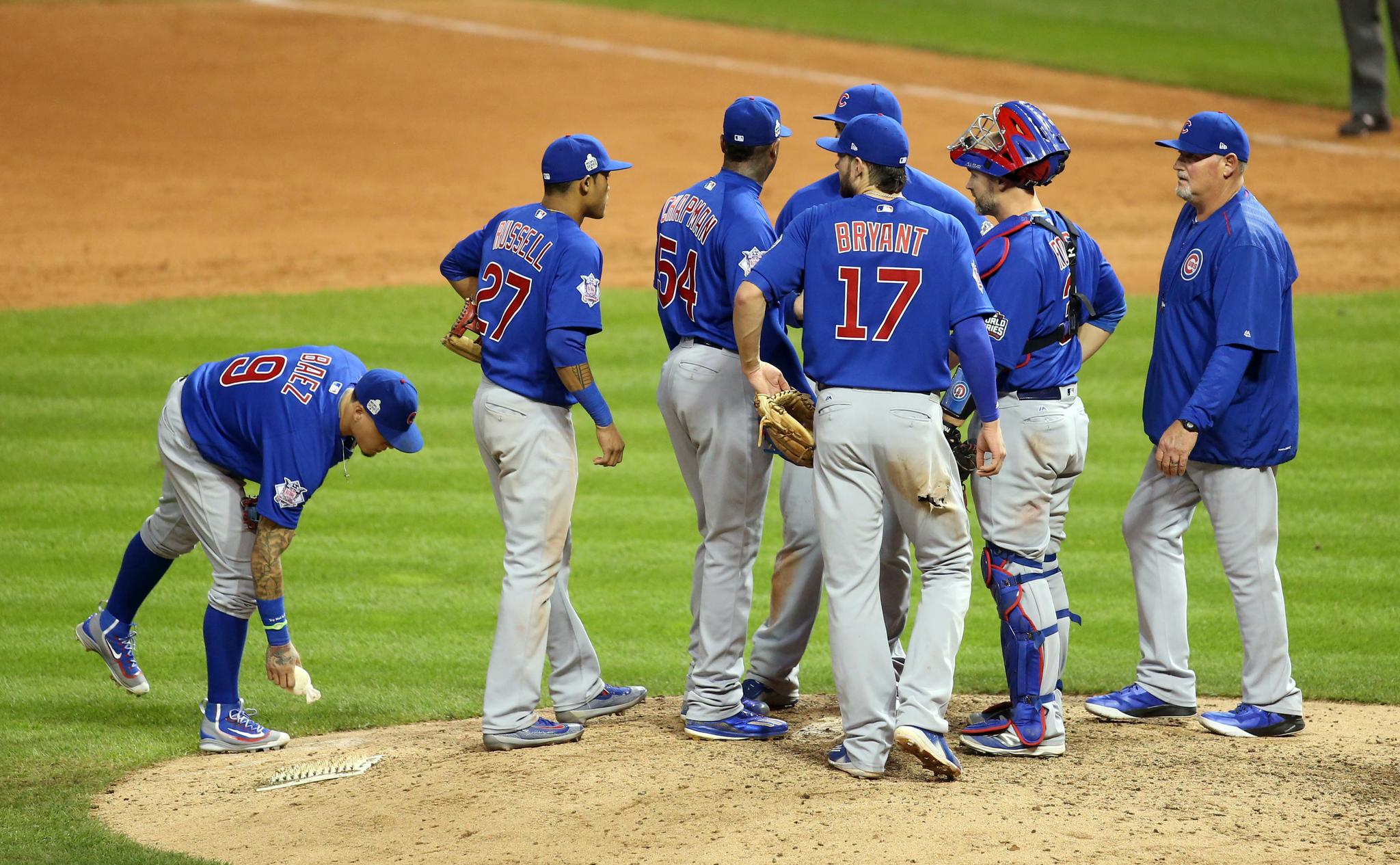 Mound meetings like this one are a factor in the pace of play.