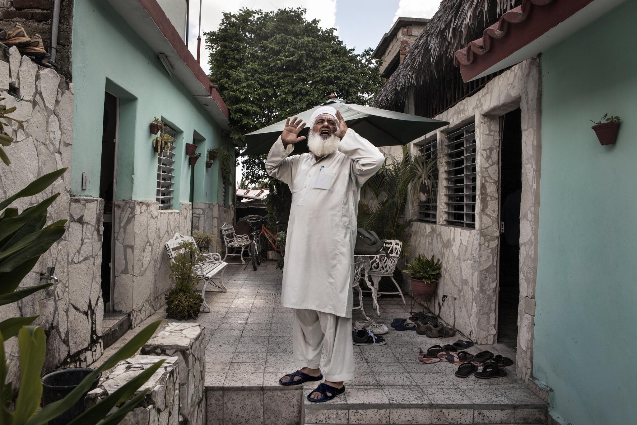 Juan Enriquez, 70, became known by his Muslim name, Yahya, after he converted to Islam in 2007. Here, he calls to Friday's prayer in the mosque of Camagüey, which was built inside a private home to avoid problems with the Cuban authorities.