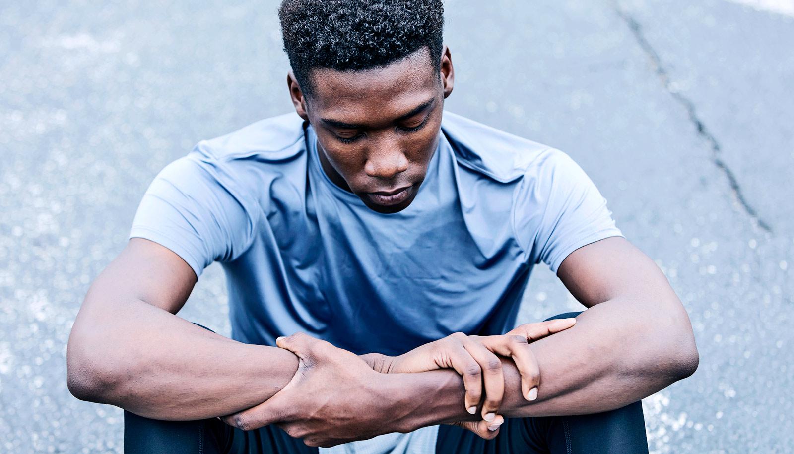 young black man sitting