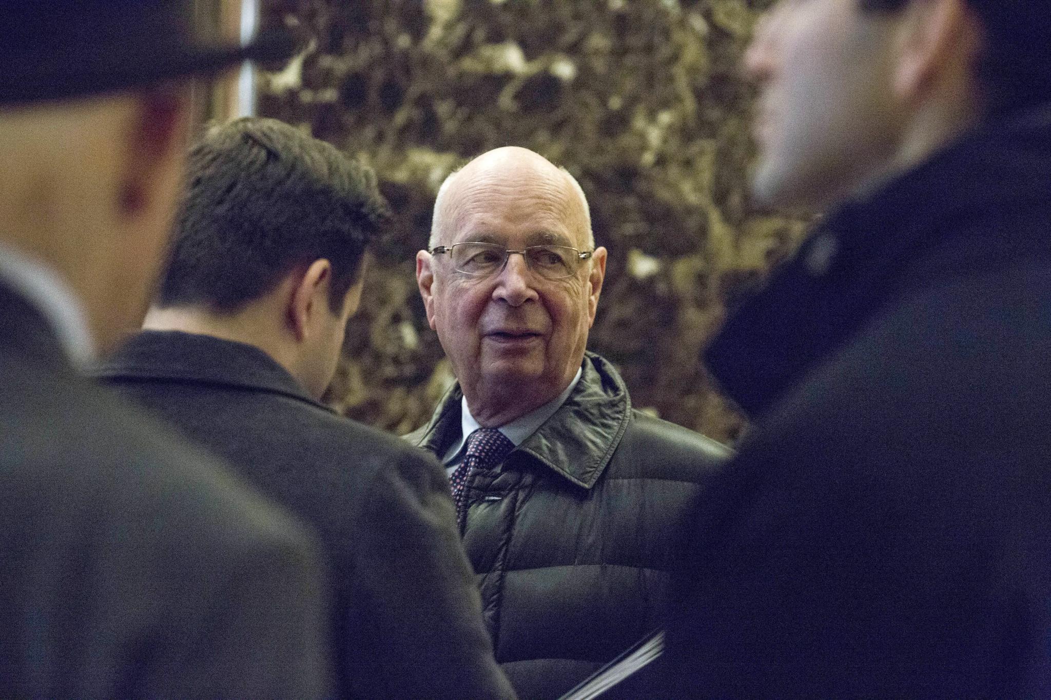 Klaus Schwab, executive chairman of the World Economic Forum (WEF), arrives in the lobby of Trump Tower in New York on December 13, 2016. Schwab was invited to a meeting with Trump.