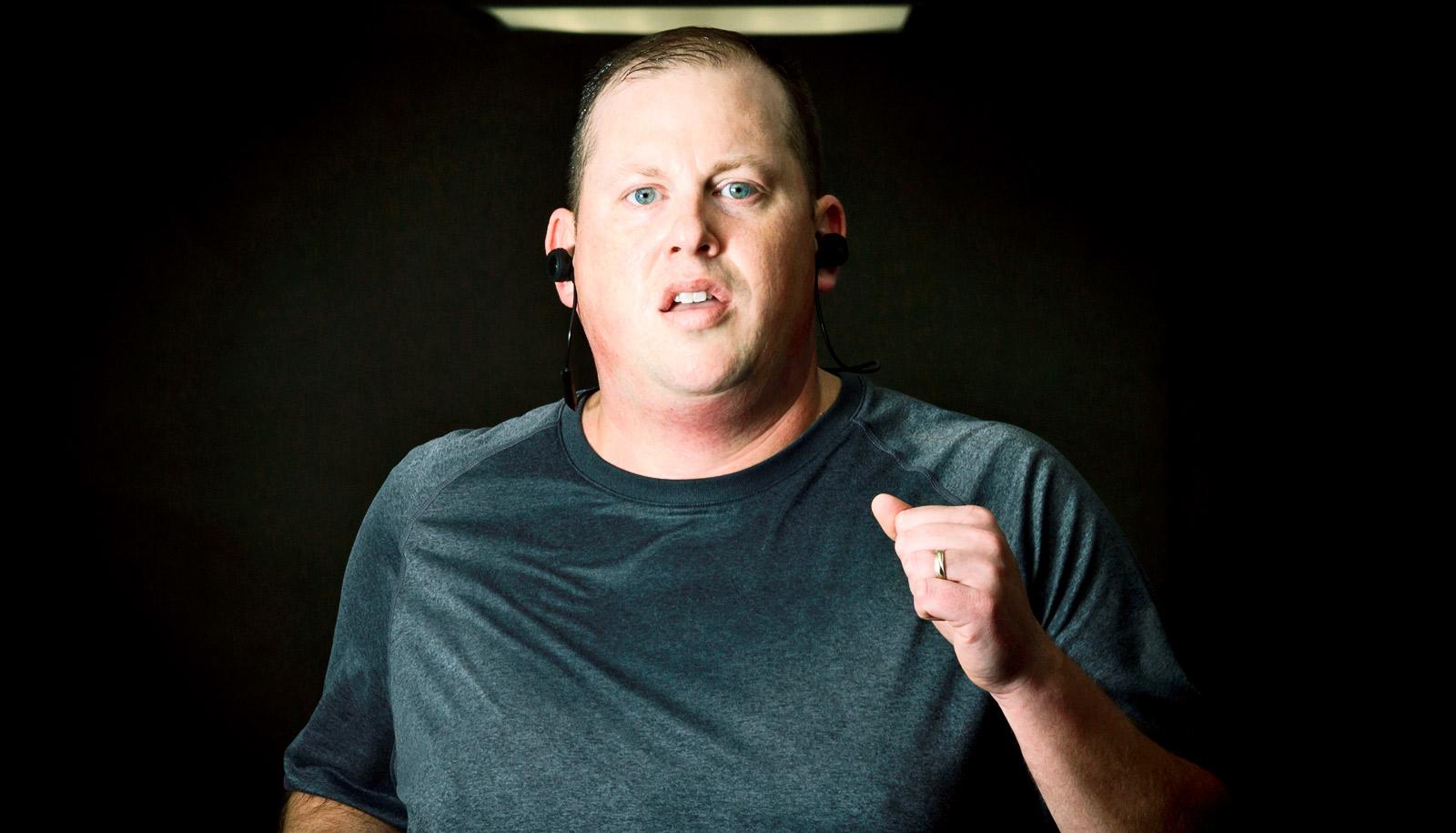 upper half of person running on treadmill