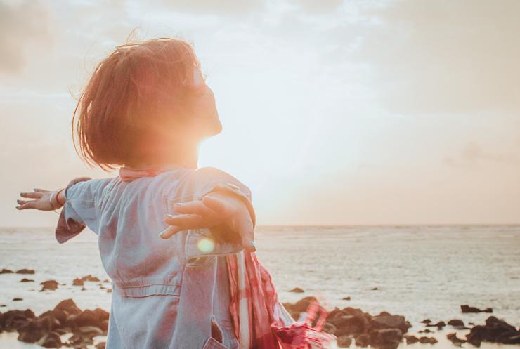 Freedom Through Forgiveness: The Emotional Causes of Eating Disorders & a Path to Recovery, by Cherie Hudson. Photograph of woman looking out over sea by Fuu J.