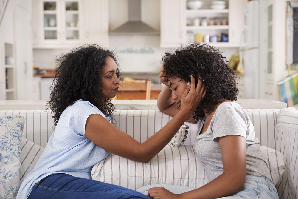 mom comforting her daughter