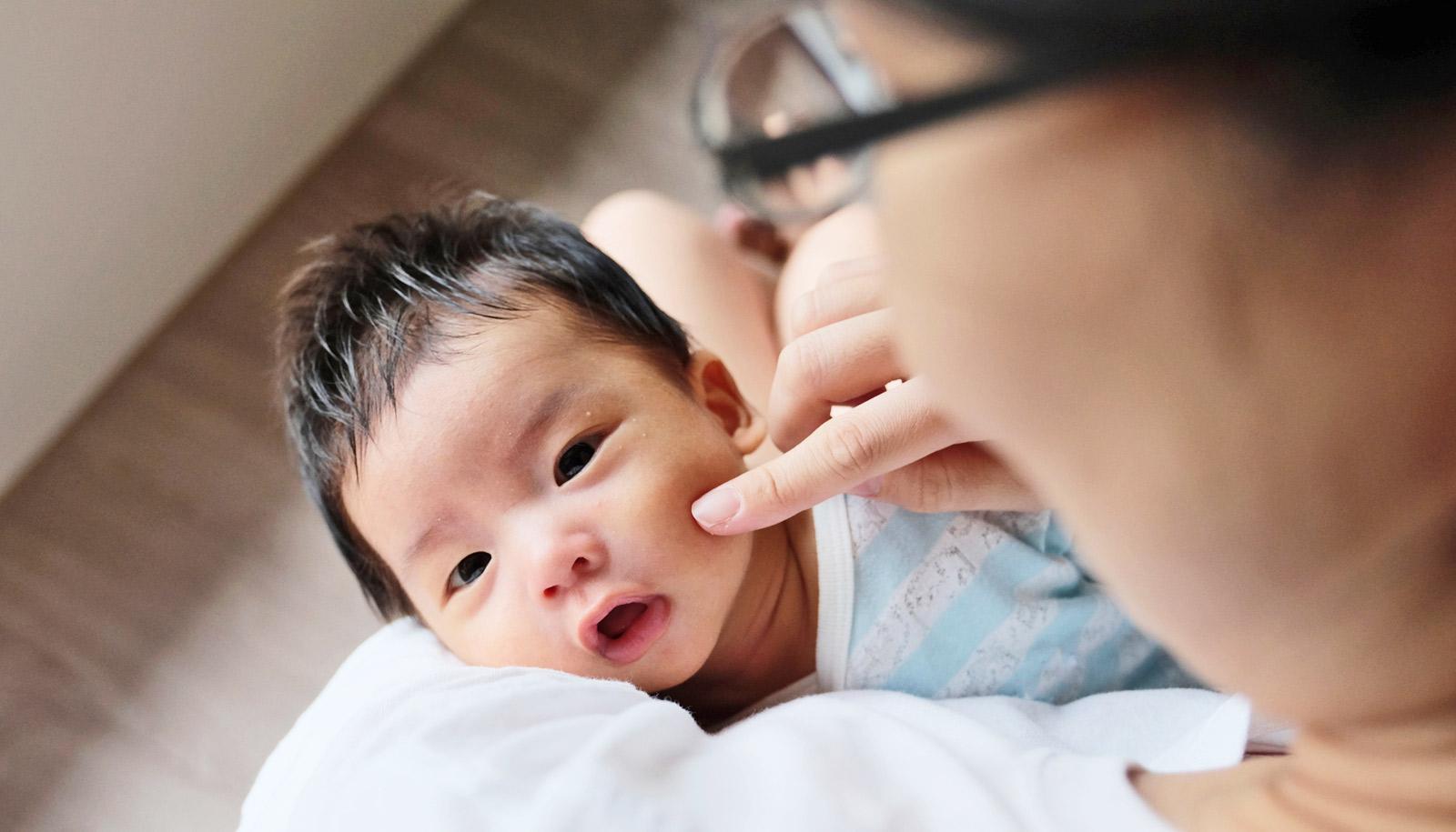 maternal vaccines - mom pokes baby's cheek