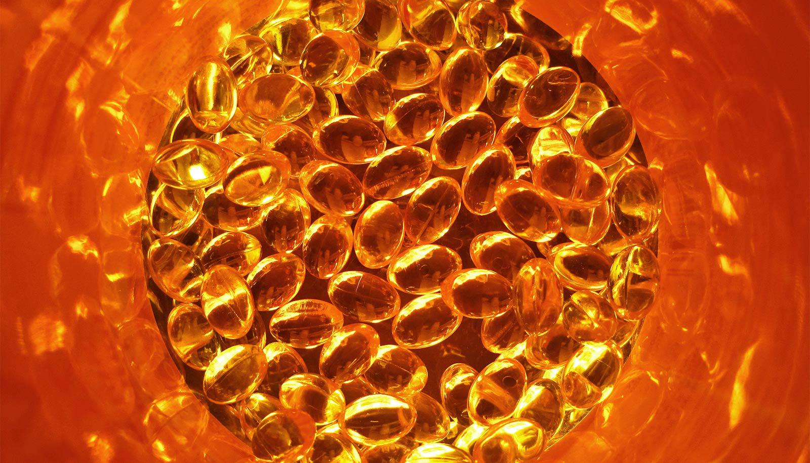 Vitamin D pills in an orange container