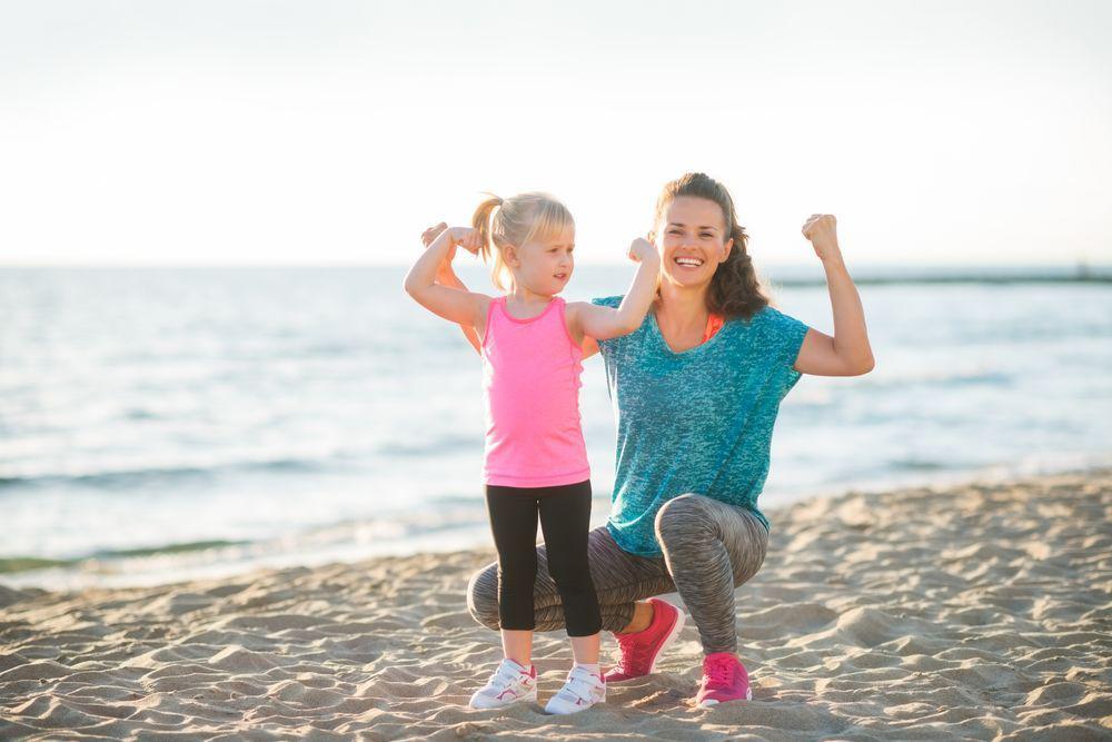 Mom and Daughter Flexing