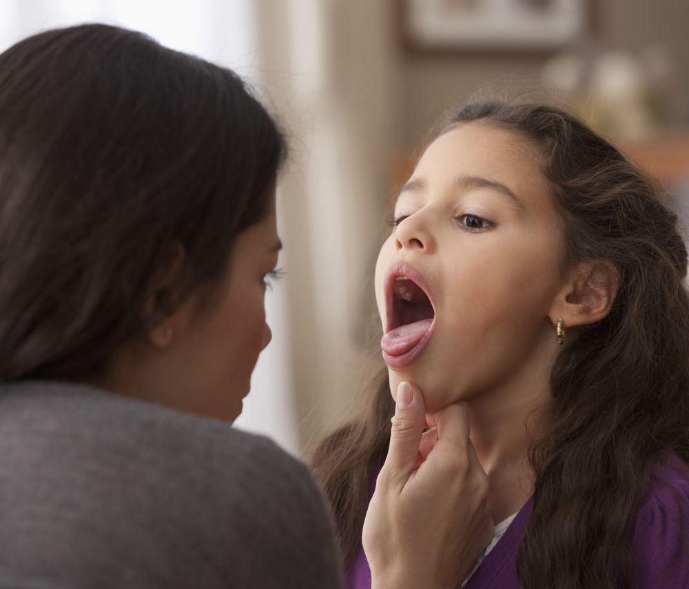 Mom taking care of her daughter